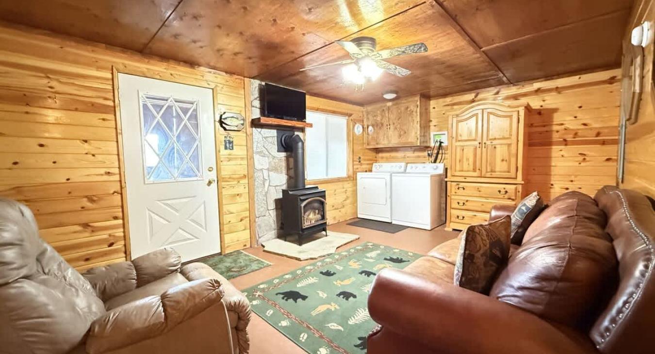 Lower level family room with  gas fireplace. Washer and dryer for guests convenience.