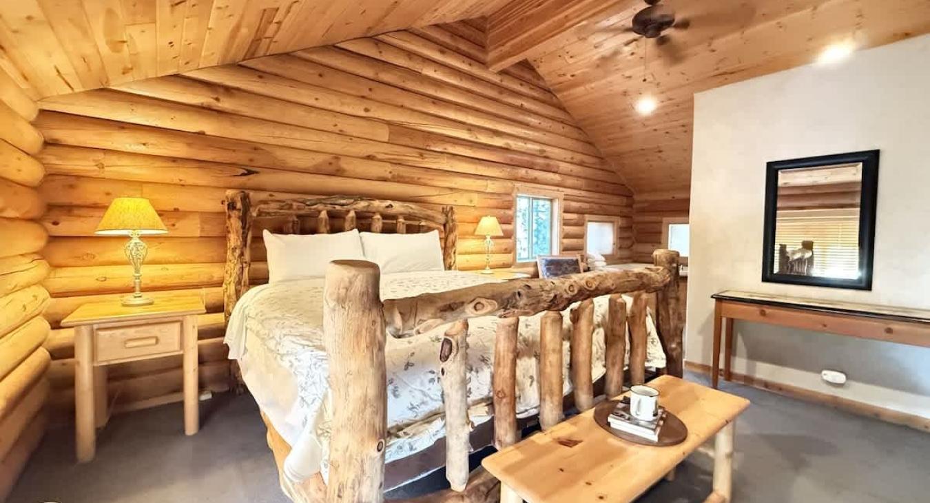 Master bedroom located upstairs with a King size bed.