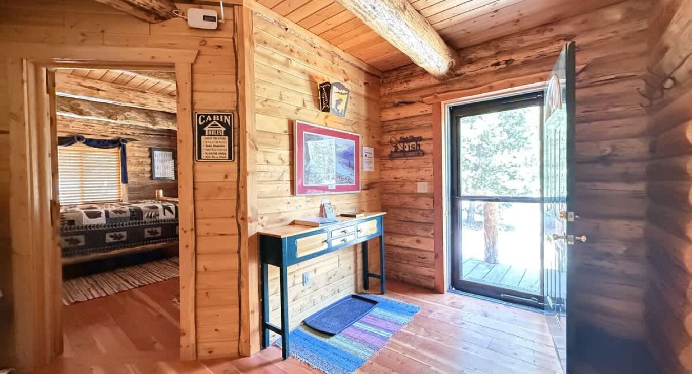 Entryway with access to the living room.