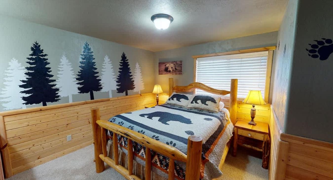 Room is equipped with a queen bed.