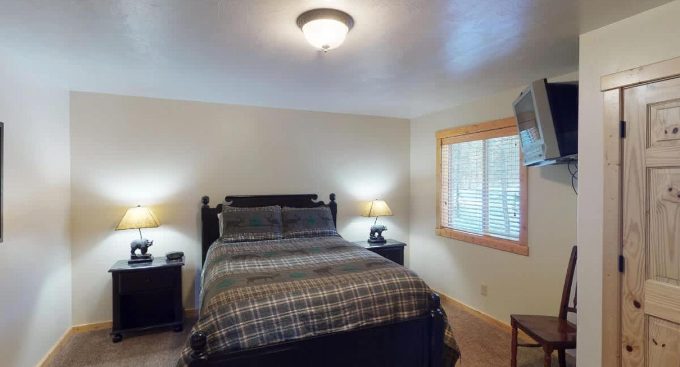 Master bedroom, bedroom #2, on the main floor with an ensuite bathroom.