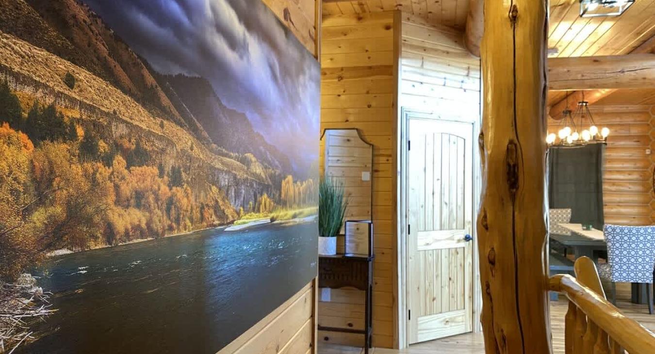 The artwork in the cabin is a perfect reflection of the natural beauty surrounding Island Park. The walls are adorned with beautiful artwork that captures the beautiful the area, showing landscapes of the nearby mountains and the river.
