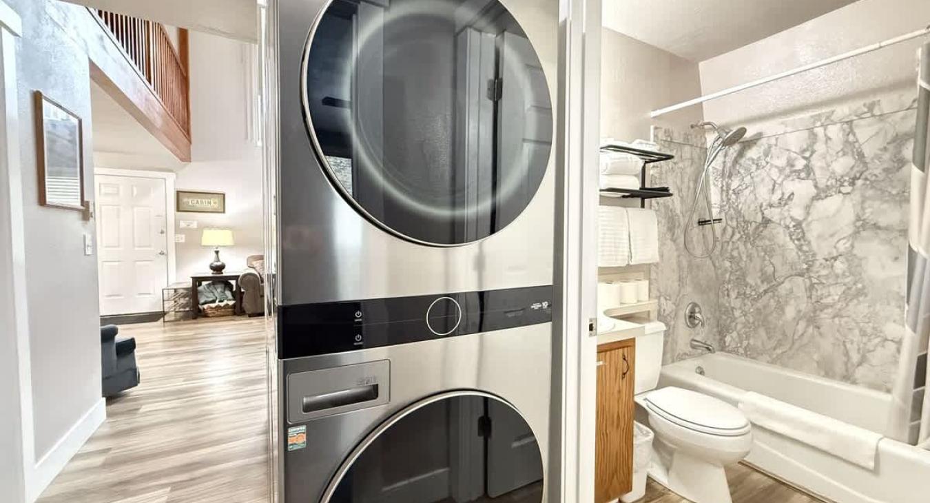 Full size stacked washer and dryer included next to the bathroom. Laundry soap is provided.