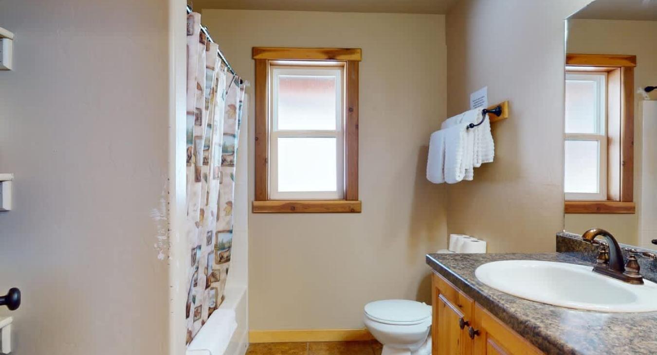 Downstairs bathroom with clean towels provided.
