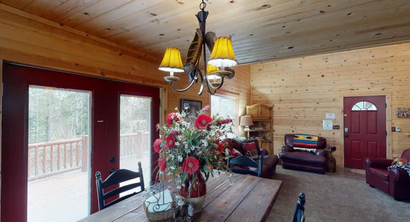 Dining room table that seats up to 4 with additional seating at the kitchen island.