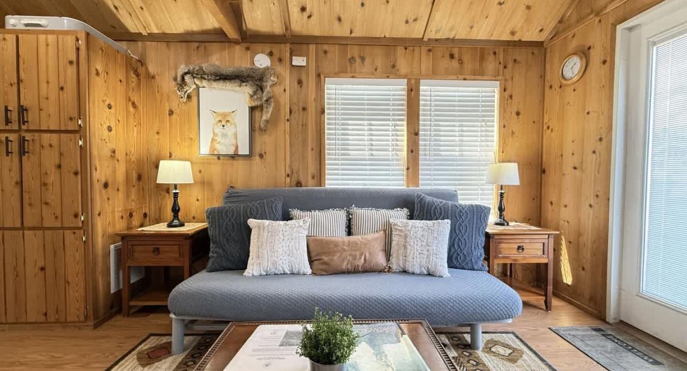 You are greeted by the living room with lots of open space and a Futon for more guests.