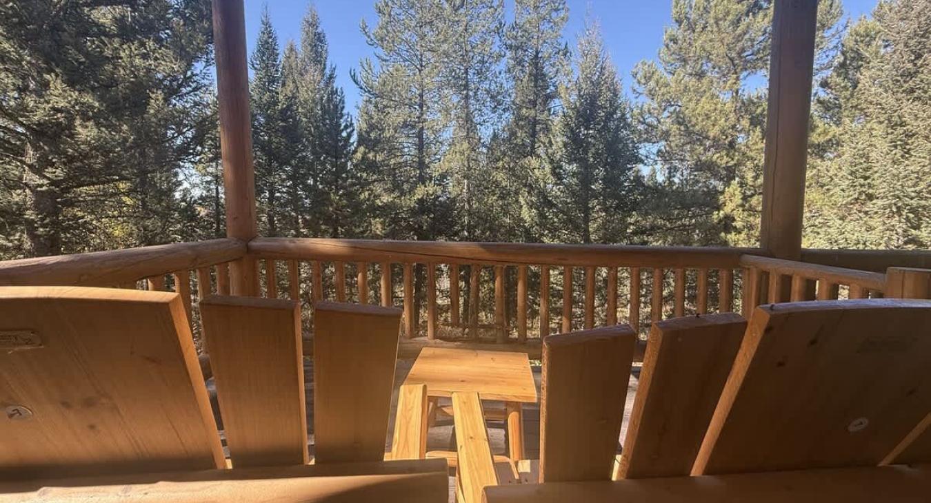 Sit back and relax on the back deck and enjoy the serenity of the outdoors.