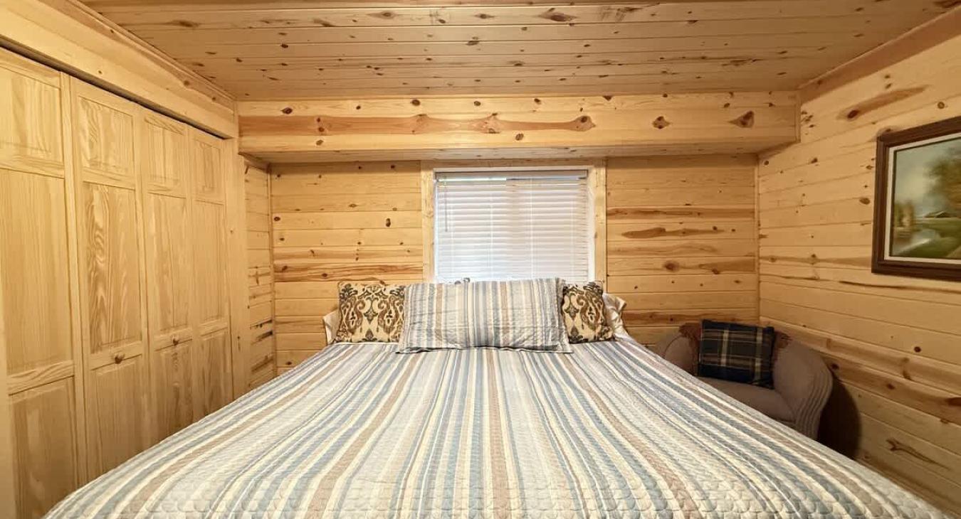 Bedroom #6 located downstairs with a King size bed.