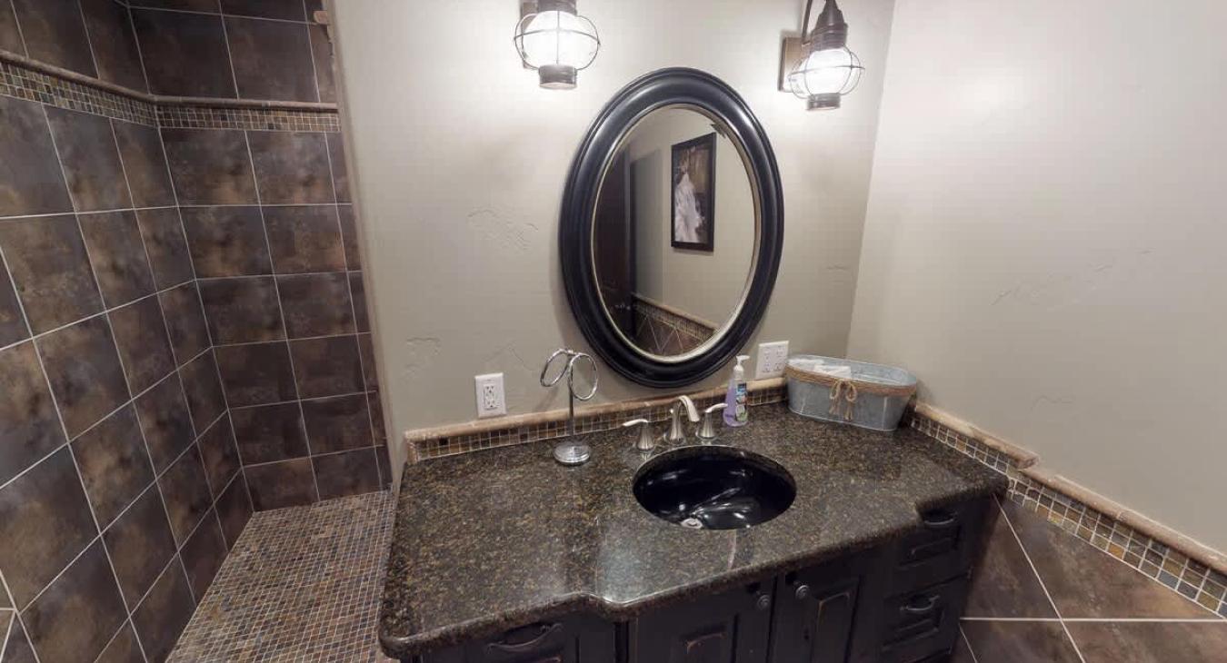 A toilet and sink vanity is also included in the bathroom.