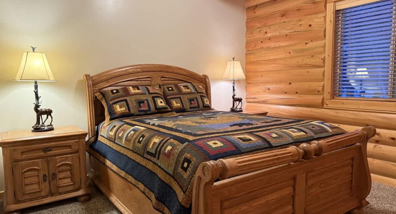 Bedroom #4 located on the main level with a Queen size bed.