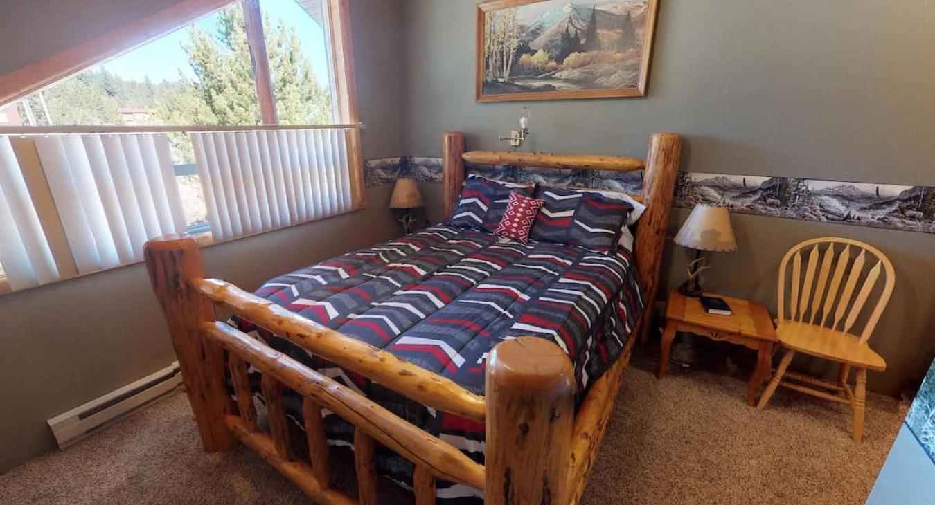 Bedroom #2 located upstairs with a Queen size bed.