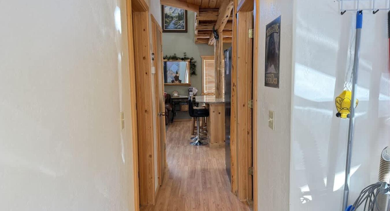 The hallway that leads you from the back door to the main area of the cabin.