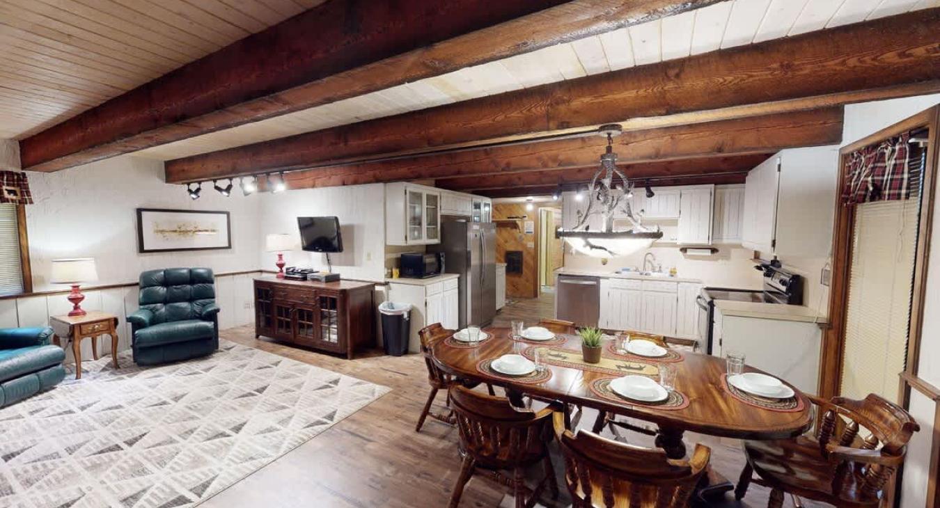 Upon entrance you are greeted by the dining area, living room, and kitchen.