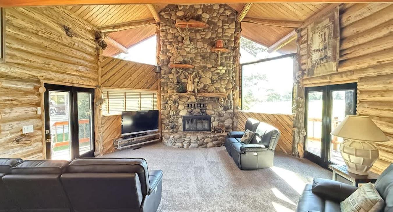 Enjoy the natural light in the living room with seating to relax during your stay.