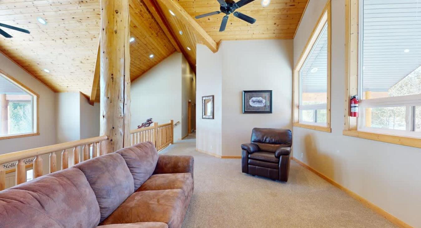 Couch and lounge chair located in the loft upstairs.