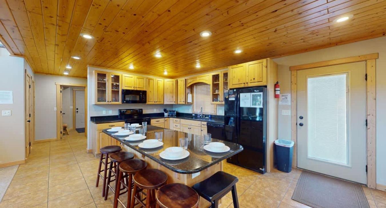 The openness of the kitchen makes it easy to chat with friends or family while cooking, or to catch the glow of the fire and the sound of laughter as you move between the rooms.