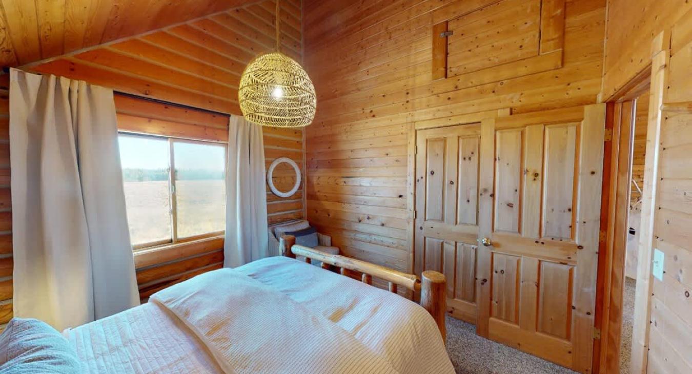 Bedroom #3 located upstairs with a Queen size bed.