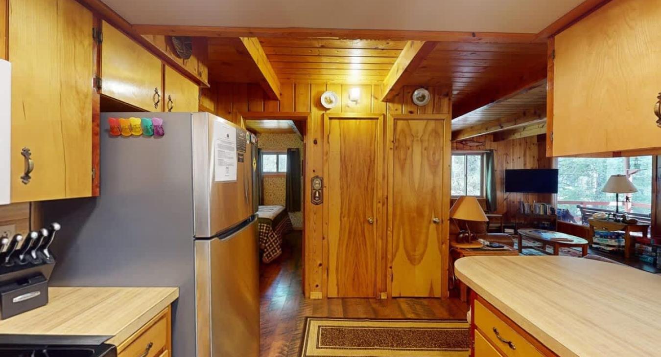 The wood accents in the kitchen give the cabin a cozy atmosphere.