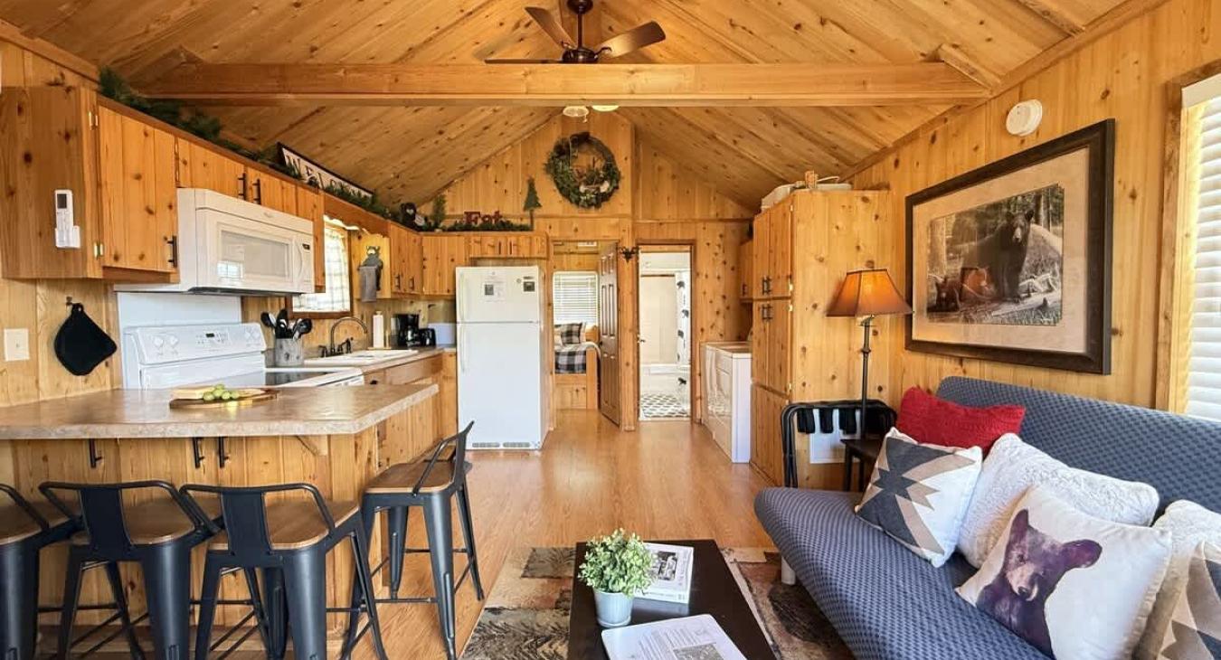 Upon entrance there is a view of the kitchen and living room area.