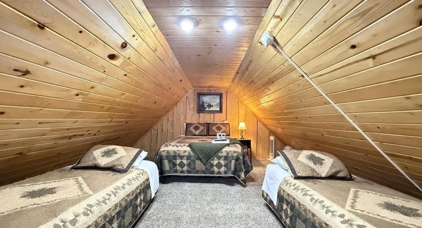 Upper Loft with 2 twin beds and a Queen.