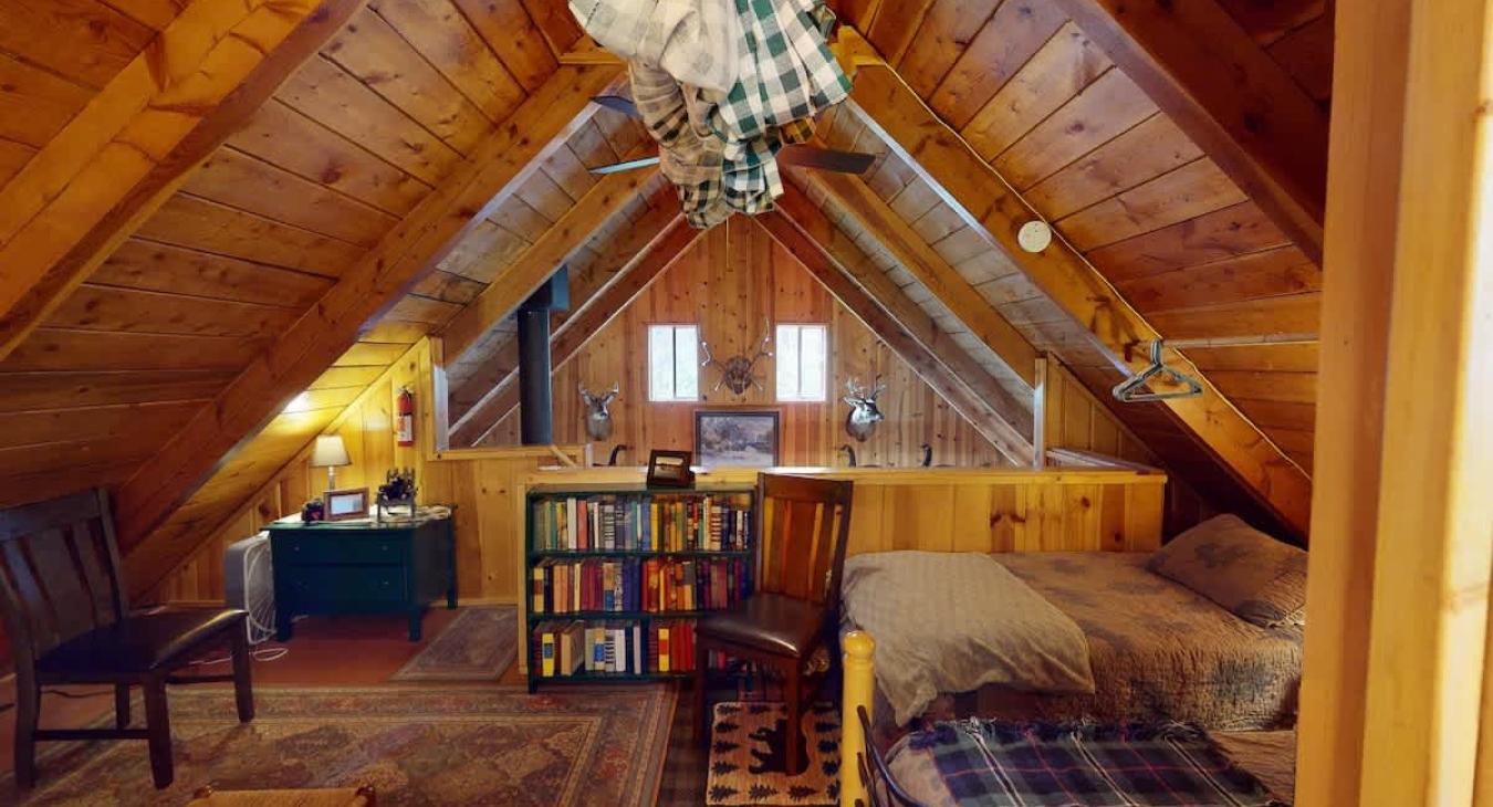 Cozy bedroom area upstairs that sleeps comfortably 3 people.