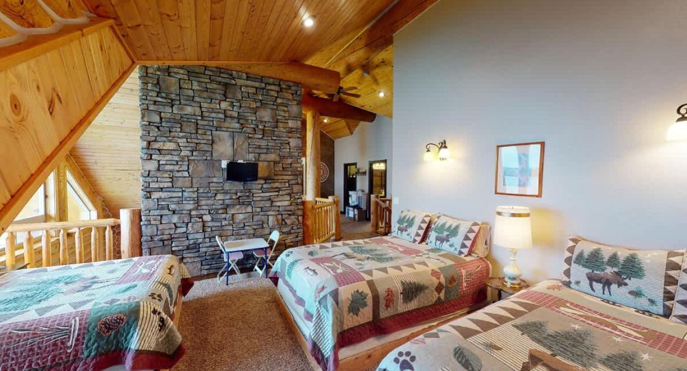 East wing loft is equipped with 3 Queen size bed.