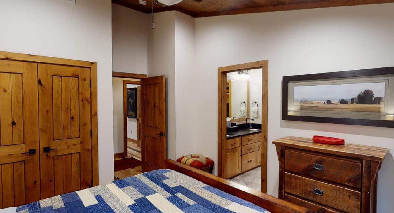 View from the first bedroom side of the bed looking towards the hallway.