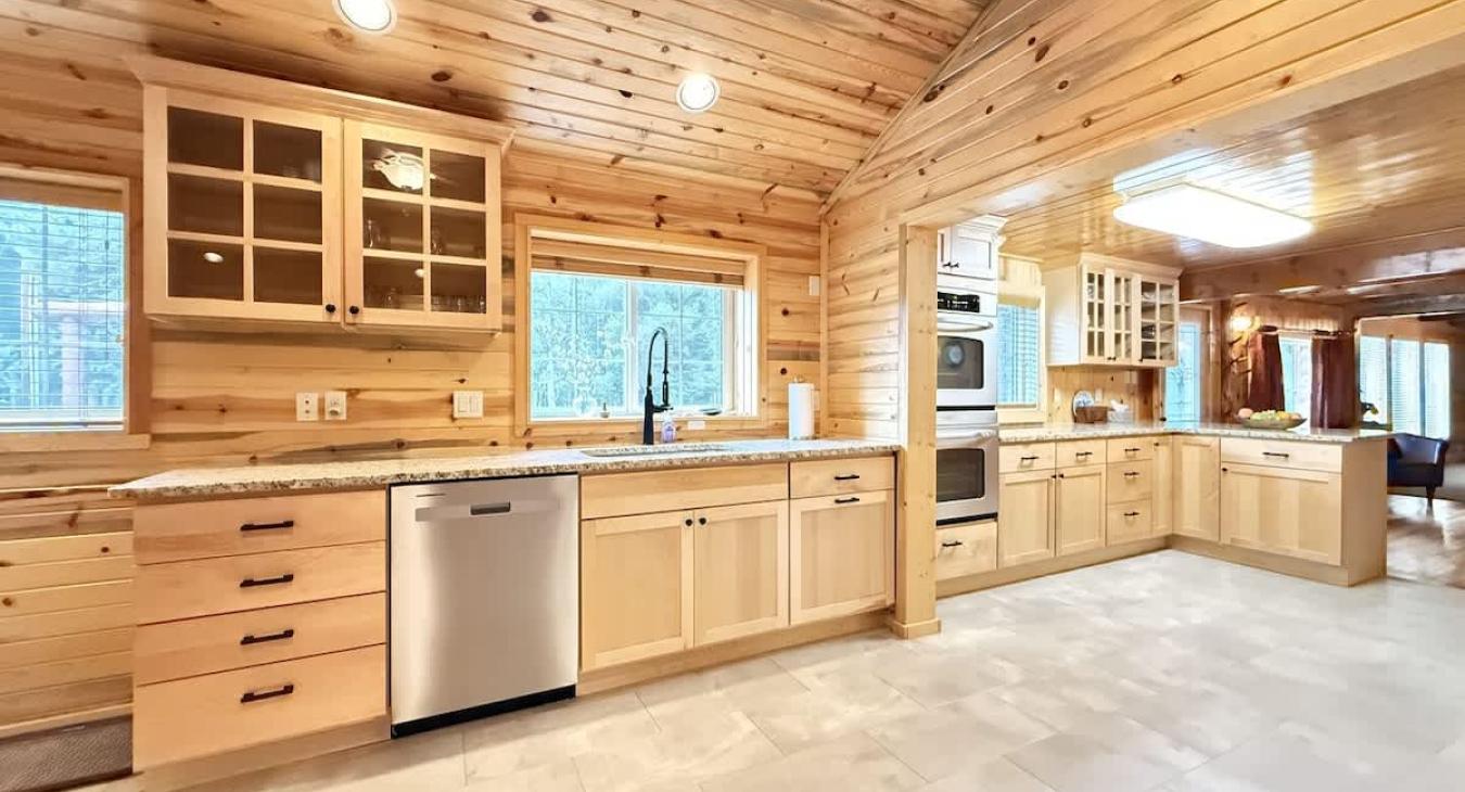 Full kitchen with appliances, cookware, dishes, silverware, and basic cooking spices.