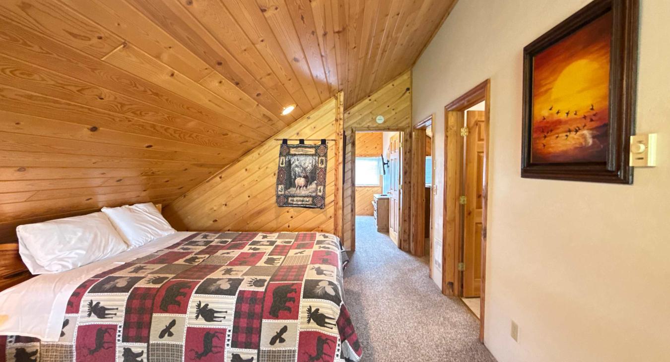 Upstairs loft with a queen bed.