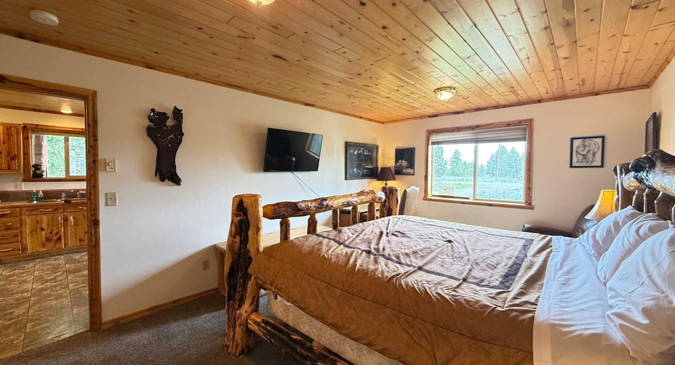 King bed in the Master Suite. Smart tv and desk.