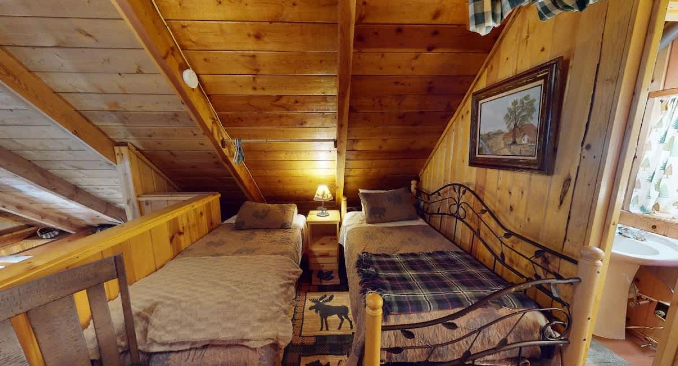 Two twin beds located in the loft.