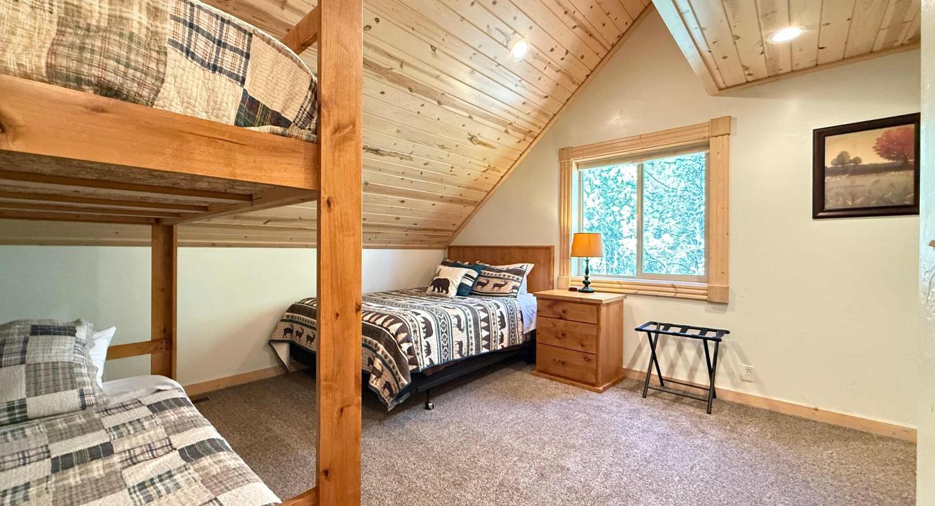 Bedroom #2 located upstairs with a Queen and a bunk bed.