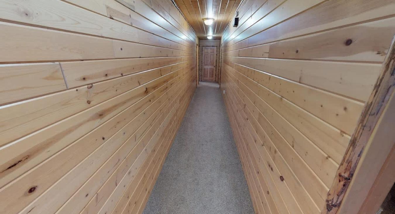 Long hallway to access the different rooms and bathrooms.