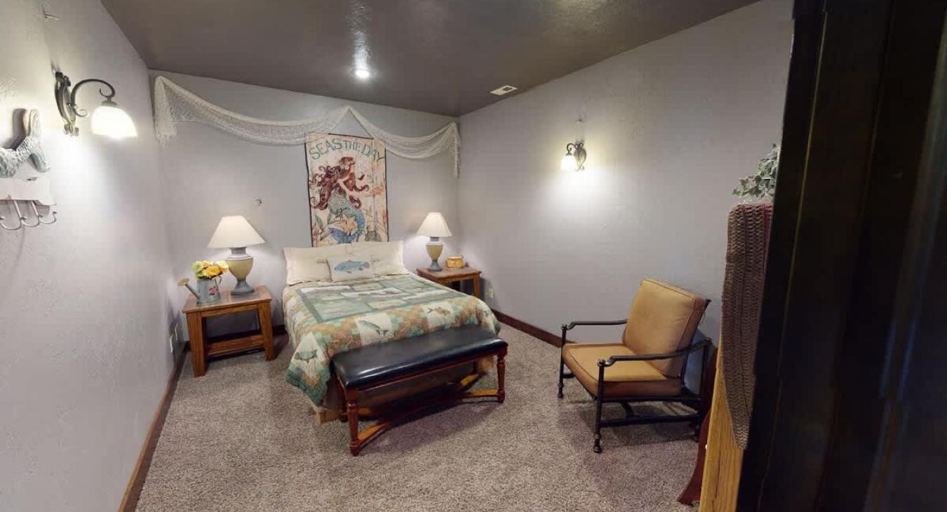 Bedroom #4 downstairs with a Queen size bed.