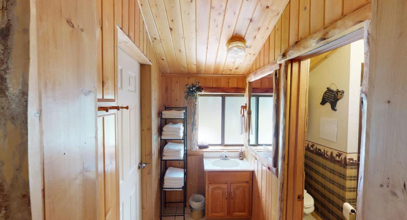Ensuite bathroom with shower, toilet, and sink.