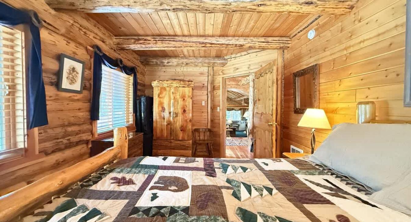 Bedroom #1 located downstairs with a Queen size bed.