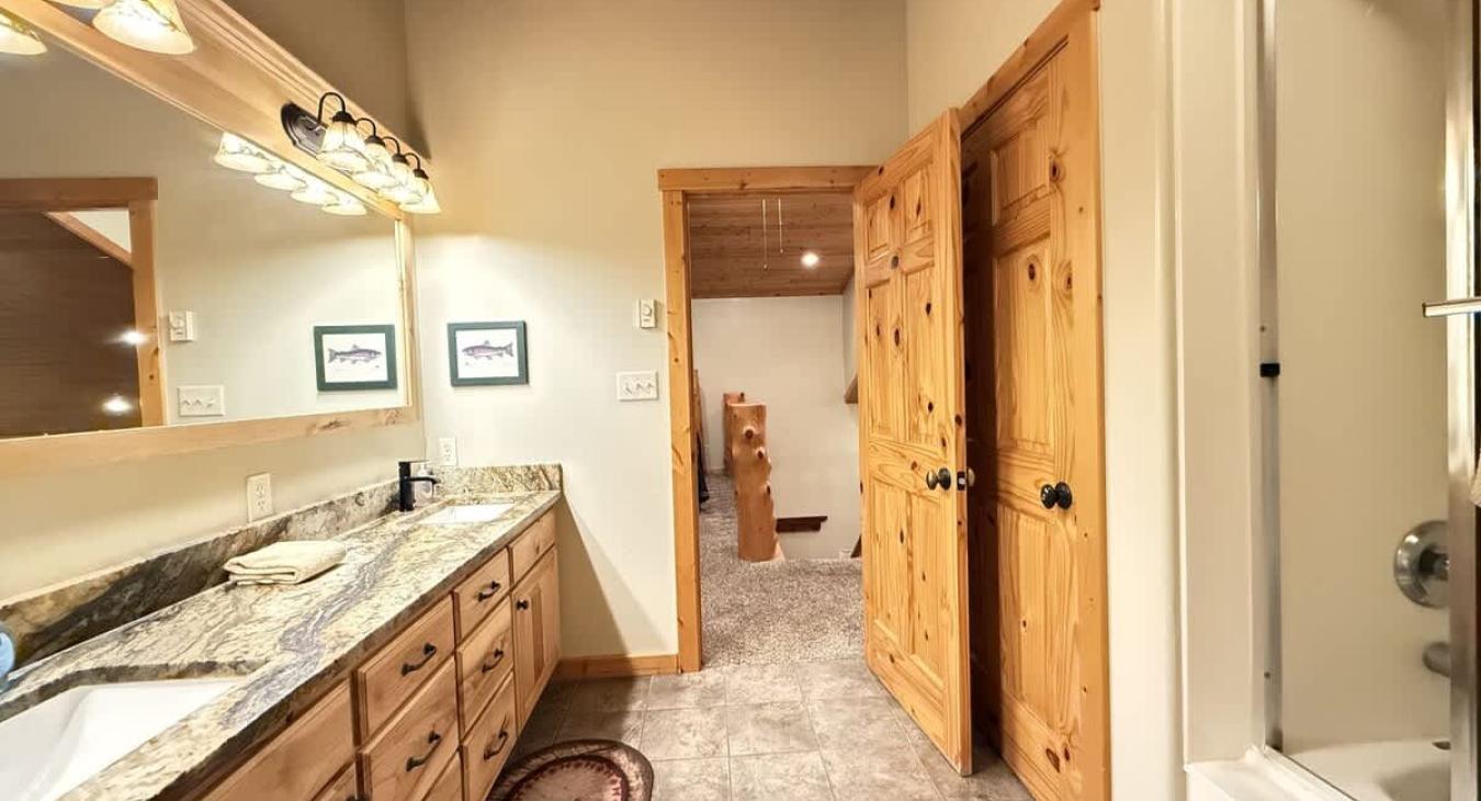 The bathroom where rustic charm meets spa-like comfort.