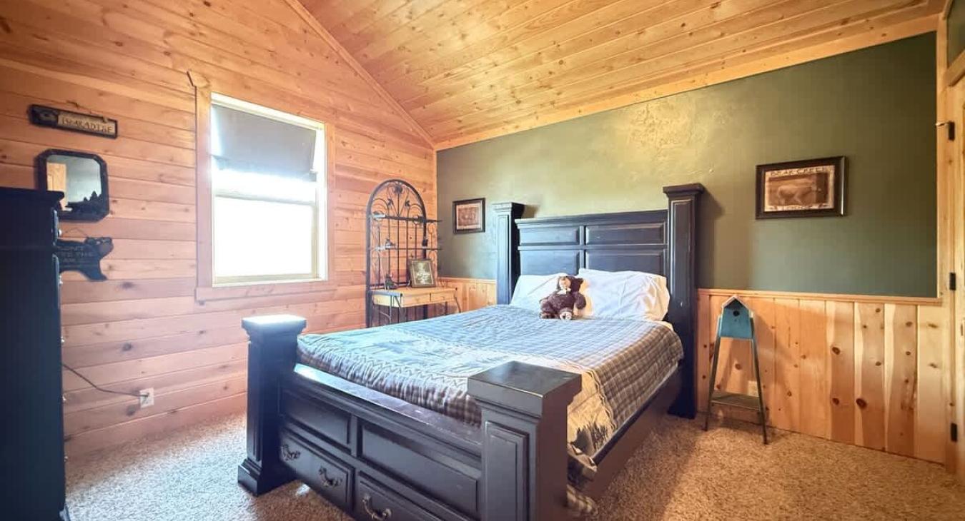 A double bed is located in the first bedroom upstairs.