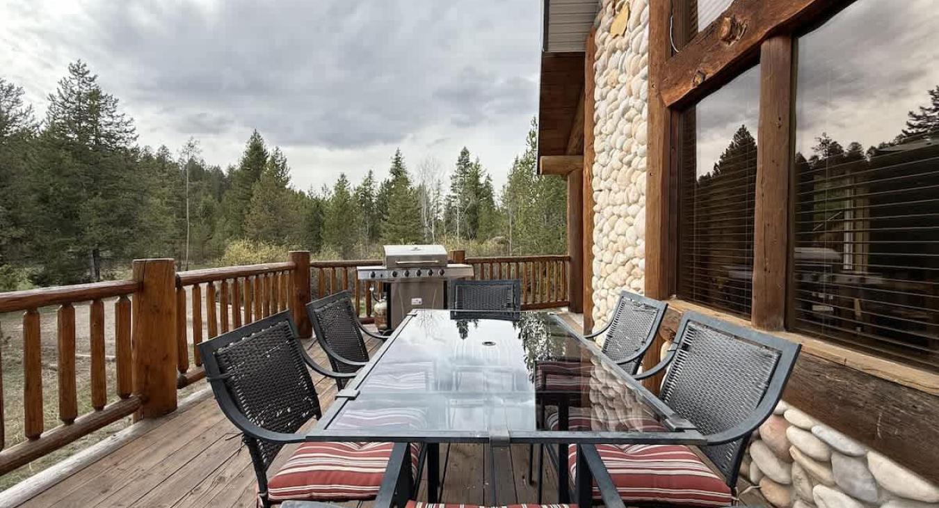 Enjoy the beautiful weather from the deck of the cabin.