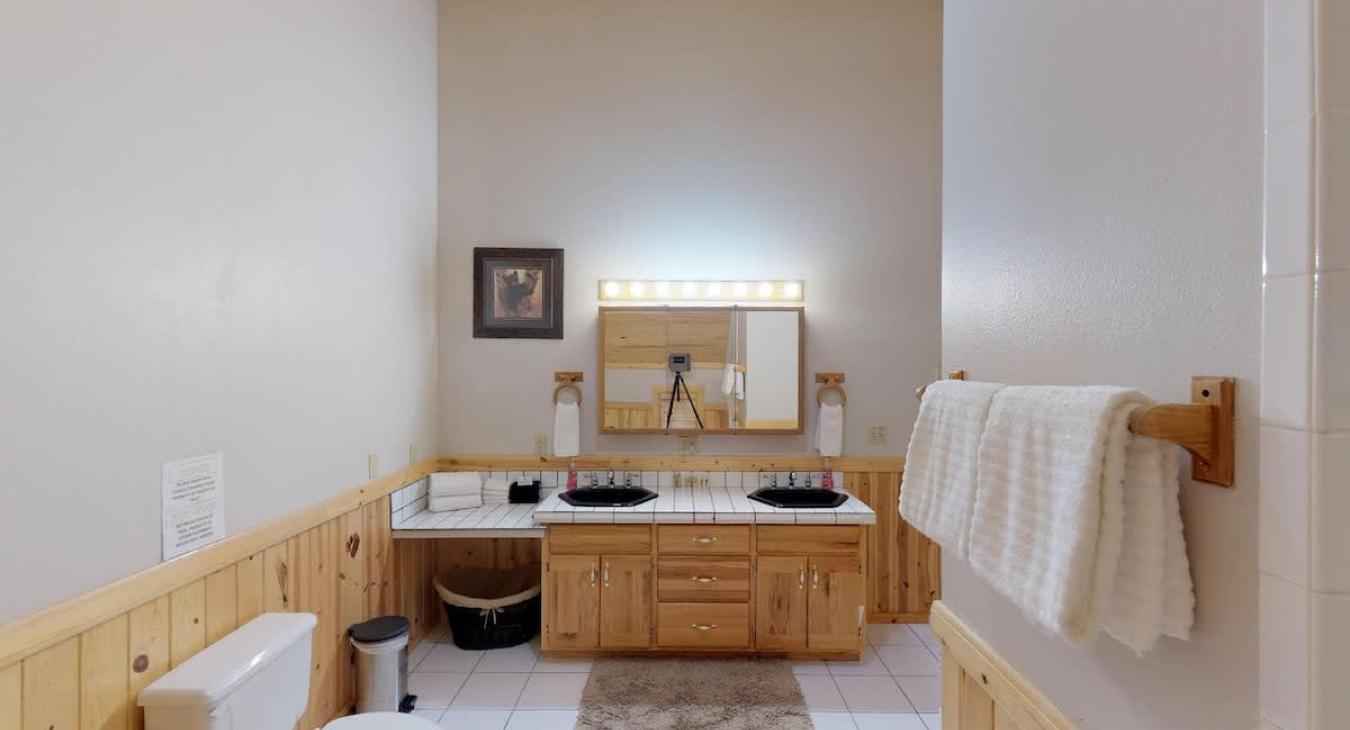 Beautiful vanity with great lighting to get ready for the day.