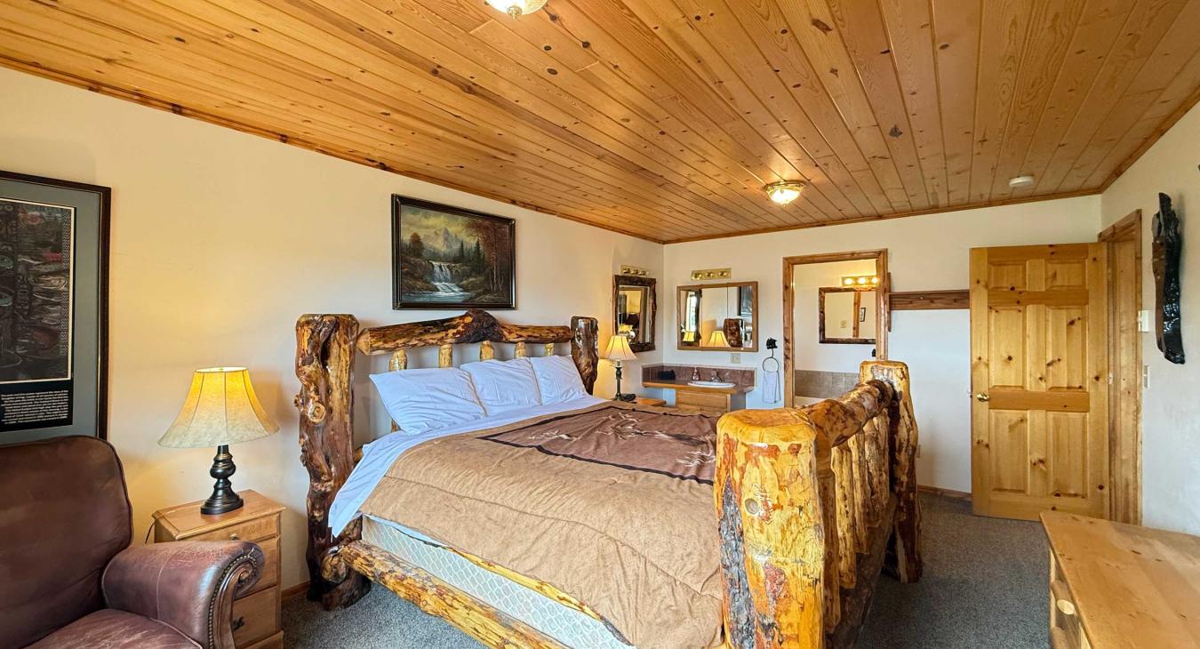 Master bedroom located on the main level with a king bed and ensuite bathroom.