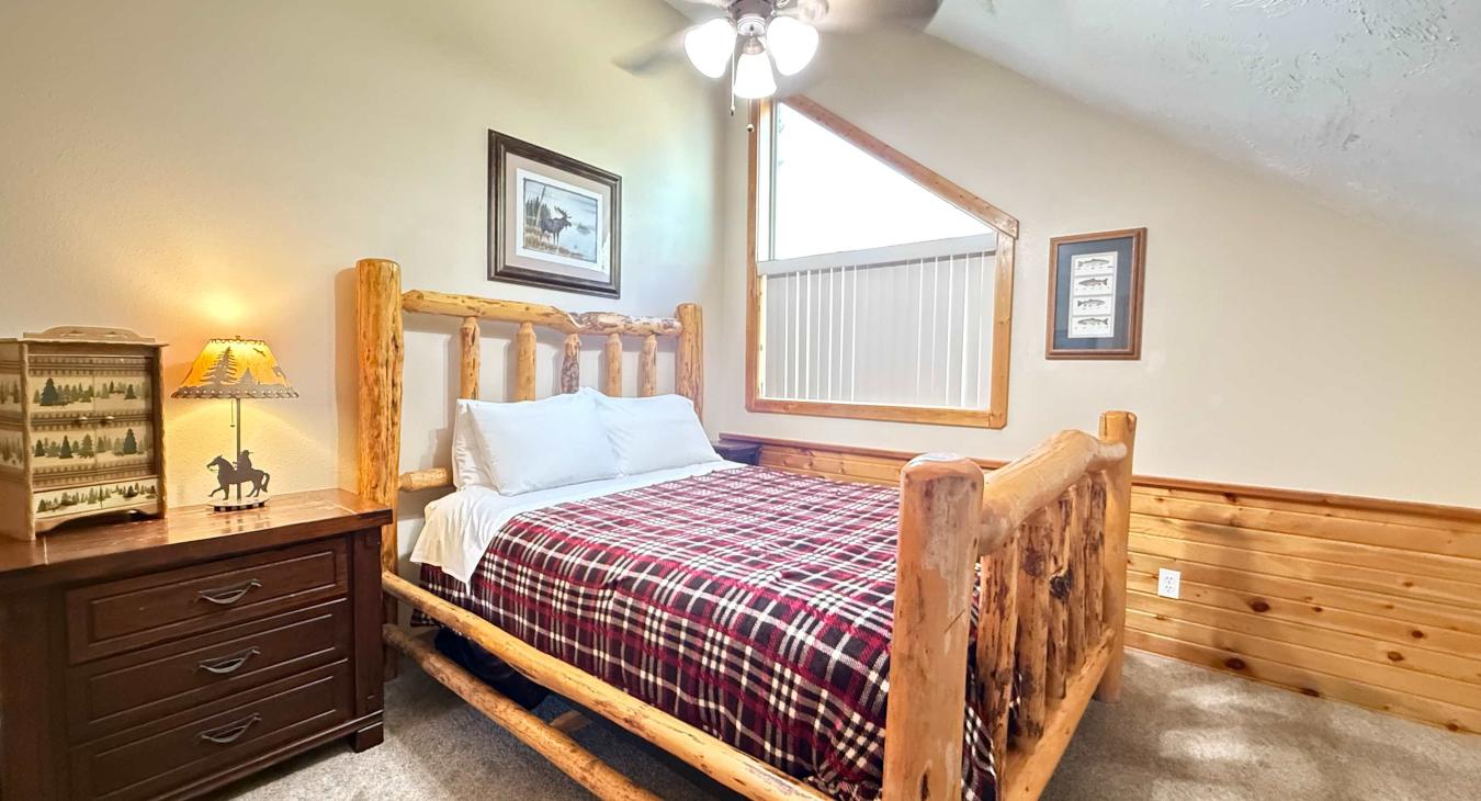 Lots of natural light in this room and a ceiling fan for those summer nights.