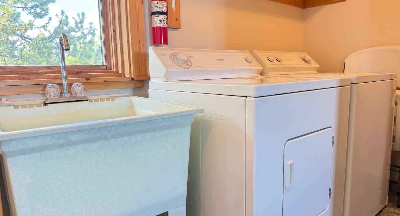 Laundry room located upstairs by the open bedroom.