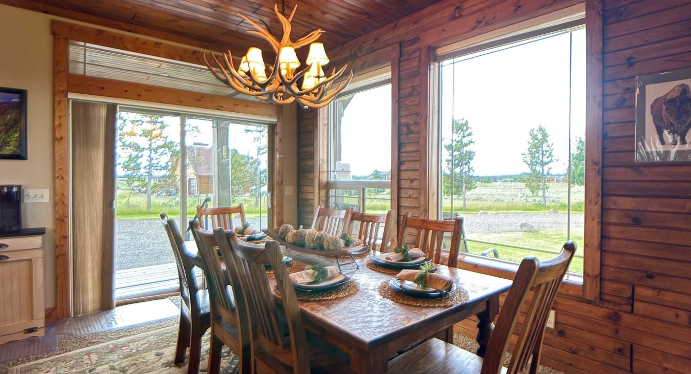 Enjoy meals under the warm glow of the unique antler chandelier, surrounded by large windows that look out onto the beautiful scenery.