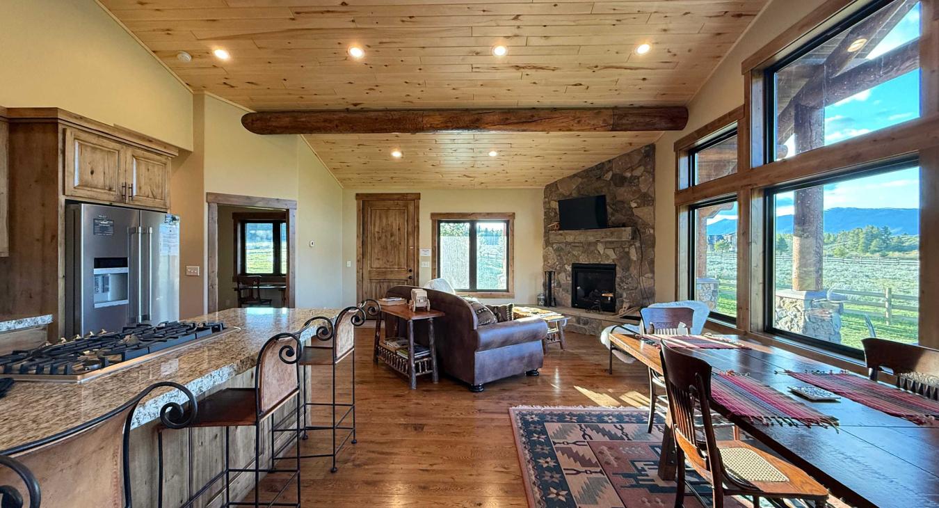 Seating available at the kitchen island as well as the dining table.