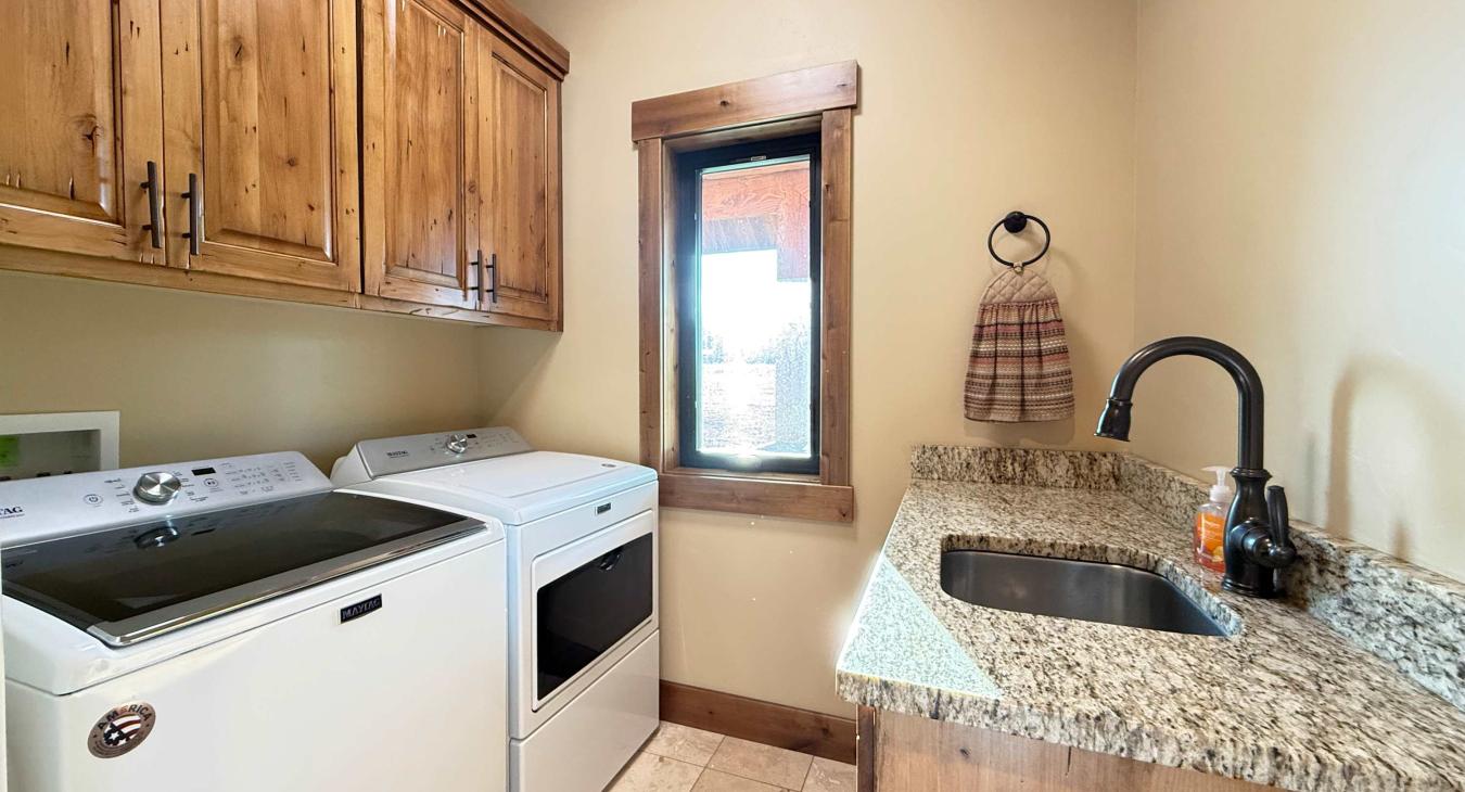 Laundry room with washer and dryer. Laundry soap is provided.