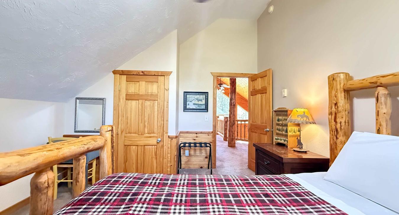 Bedroom #3 located upstairs with a Queen size bed.