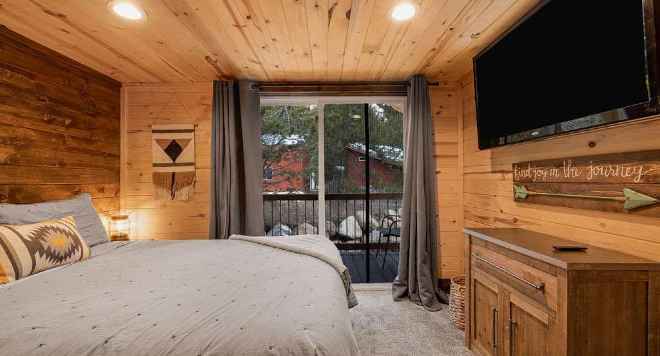 The main level bedroom has a small private porch.