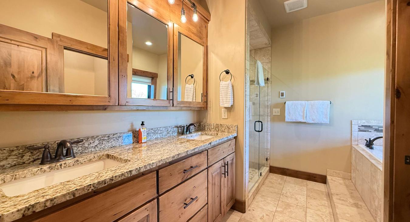 Ensuite Master bathroom with double vanity and standing shower.