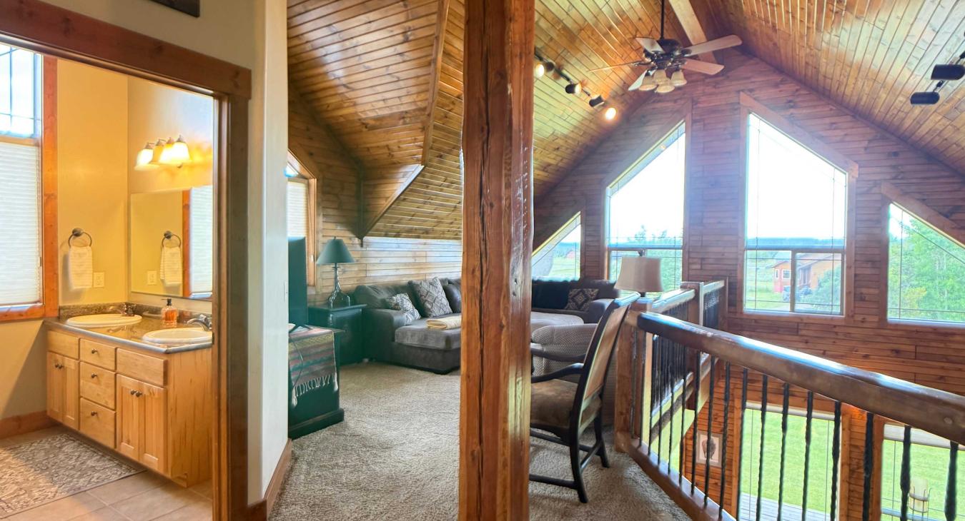 The versatile loft space includes convenient access to an upstairs bathroom, making it a fully functional secondary living area.